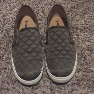 Army green quilted slip on shoes.